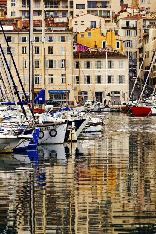 a harbor filled with lots of boats next to tall buildings, a picture, renaissance, traditional corsican, lots de details, colour photograph, square