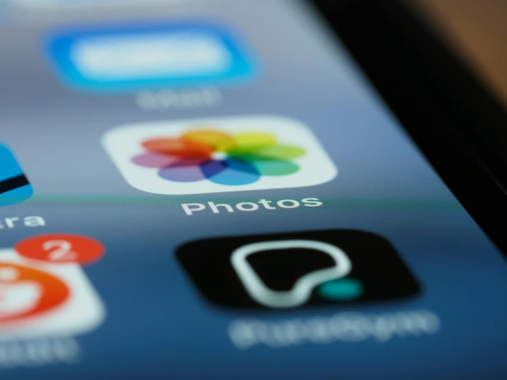 a close up of a cell phone with various apps on it, a picture, by Robbie Trevino, pexels, photorealism, ios app icon, unfocused, polaroide photo, ap news photo