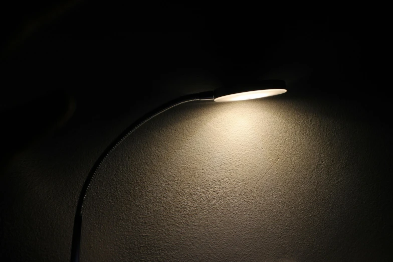 a close up of a lamp on a wall, 90 degree spotlighting, curved, chiaroscuro soft lighting, ultra - quality