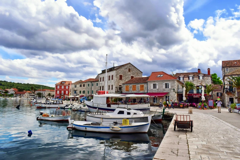 a couple of boats that are in the water, by Jan Rustem, pexels contest winner, small port village, square, avatar image