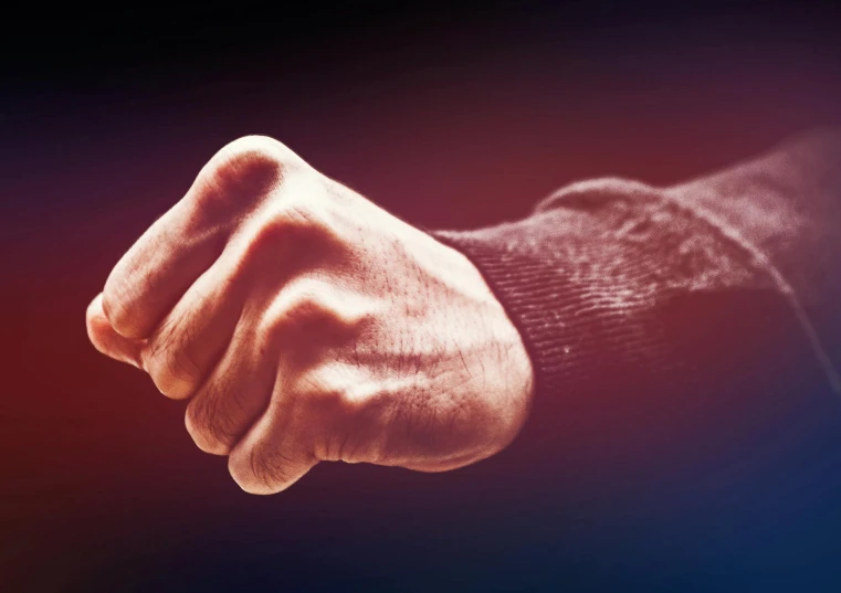 a close up of a person's fist with a blurry background, by Niko Henrichon, shutterstock, auto-destructive art, violence, promo image, a photo of a man, islamic