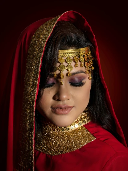 a woman dressed in a red and gold outfit, an album cover, inspired by Osman Hamdi Bey, pexels contest winner, in professional makeup, desi, arabian, bride