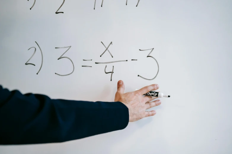 a person writing numbers on a white board, by Joe Bowler, pexels, balancing the equation, private school, background image, lachlan bailey