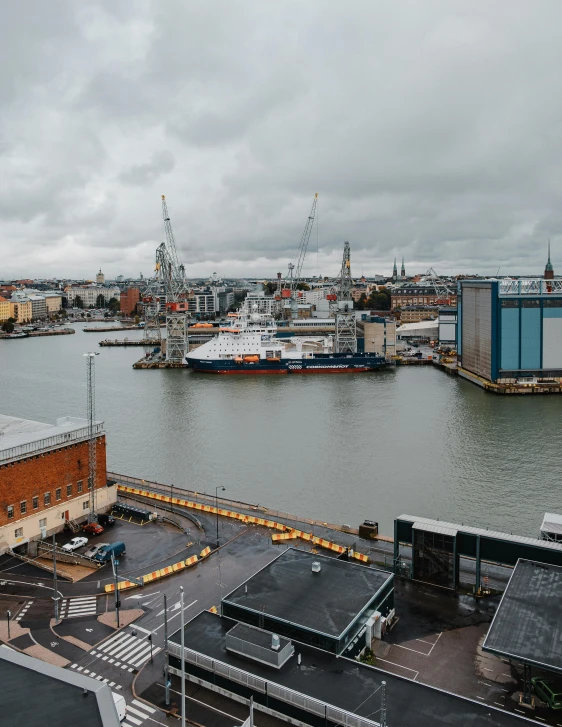 a large body of water next to a city, by Tom Wänerstrand, shipyard, gigapixel photo, low quality photo, annato finnstark