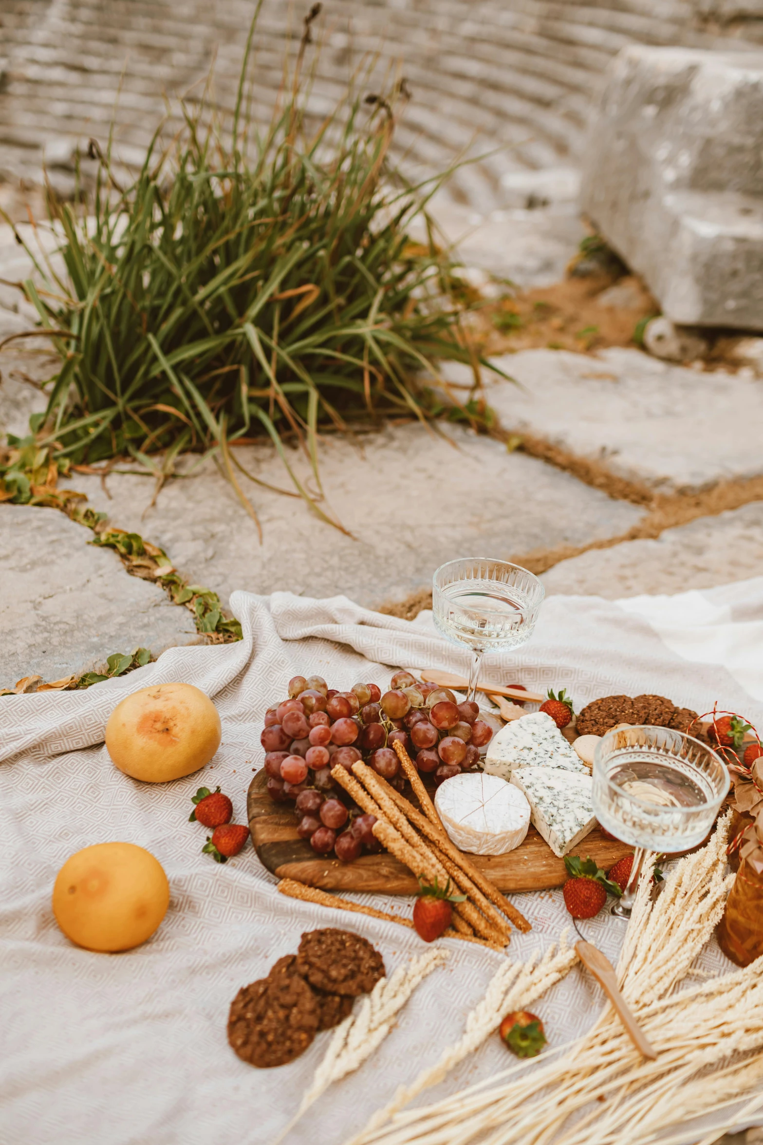 a table that has a bunch of food on it, pexels contest winner, renaissance, stand on stone floor, romantic themed, greece, linen