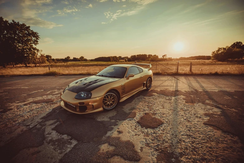 a gold sports car parked in a parking lot, a portrait, pexels contest winner, hyperrealism, toyota supra, golden hour background, 90s photo, bronze!! (eos 5ds r