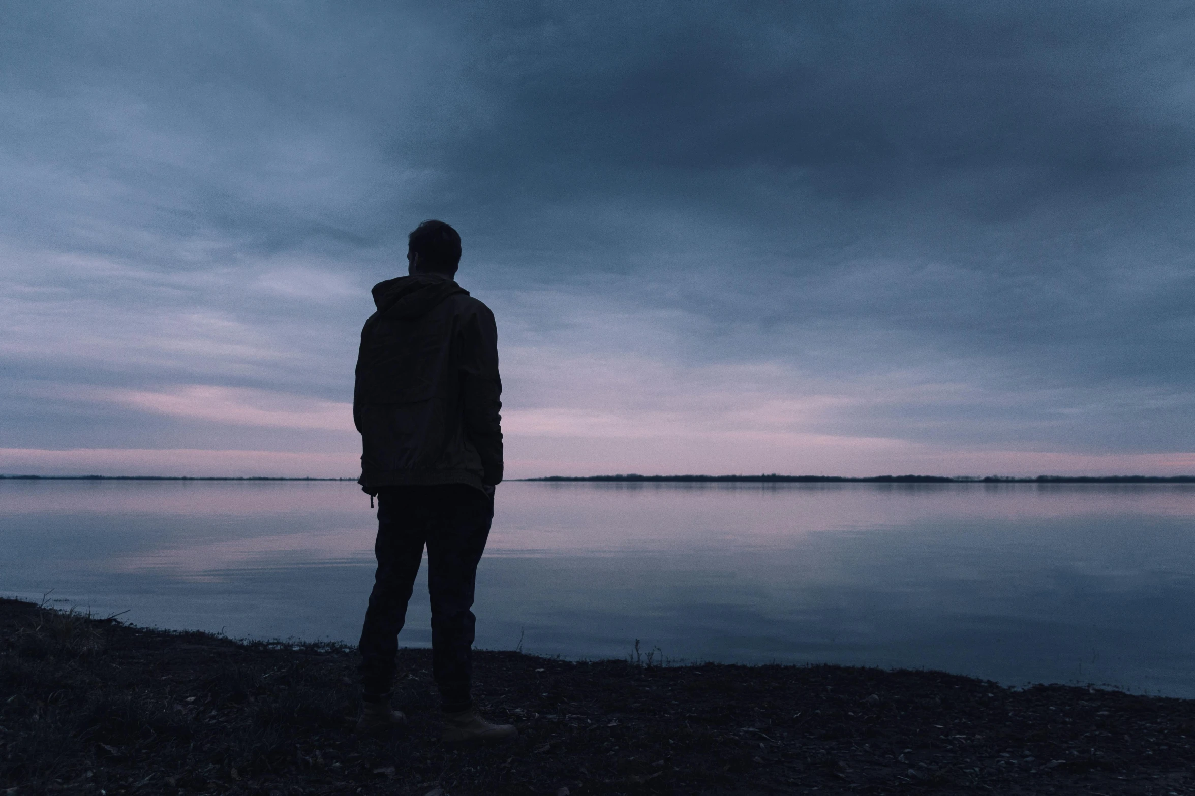 a person standing in front of a body of water, overcast dusk, sad man, profile picture 1024px, lonesome