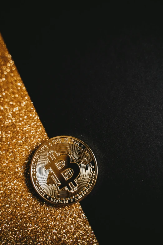 a gold bitcoin sitting on top of a black surface, an album cover, trending on unsplash, renaissance, sequins, thumbnail, background image