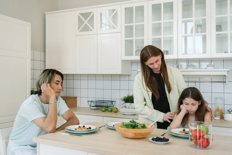 a woman and two children sitting at a kitchen counter, trending on pexels, devastated, people outside eating meals, minimalist, idealised