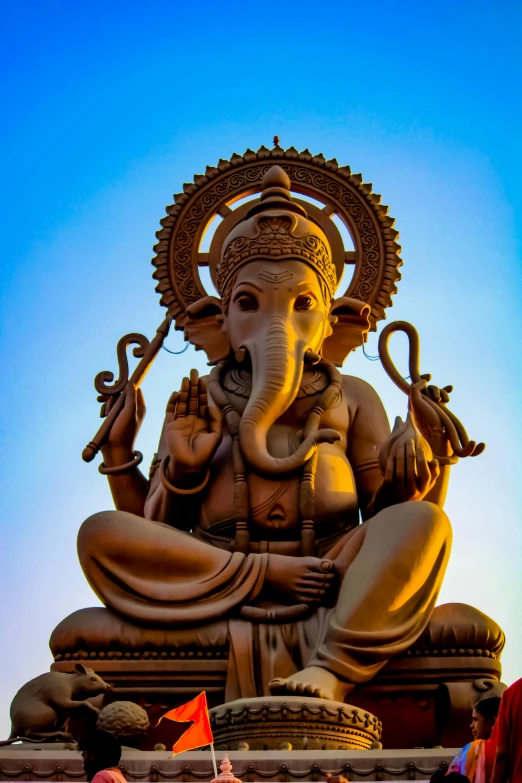 a group of people standing in front of a statue of an elephant, a statue, by Matt Stewart, pexels contest winner, samikshavad, sitting on a lotus flower, blue sky, avatar image, hindu ornaments