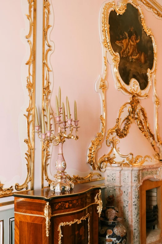 a living room filled with furniture and a mirror, rococo, pink and gold color scheme, detail shot, stanchions, on a candle holder