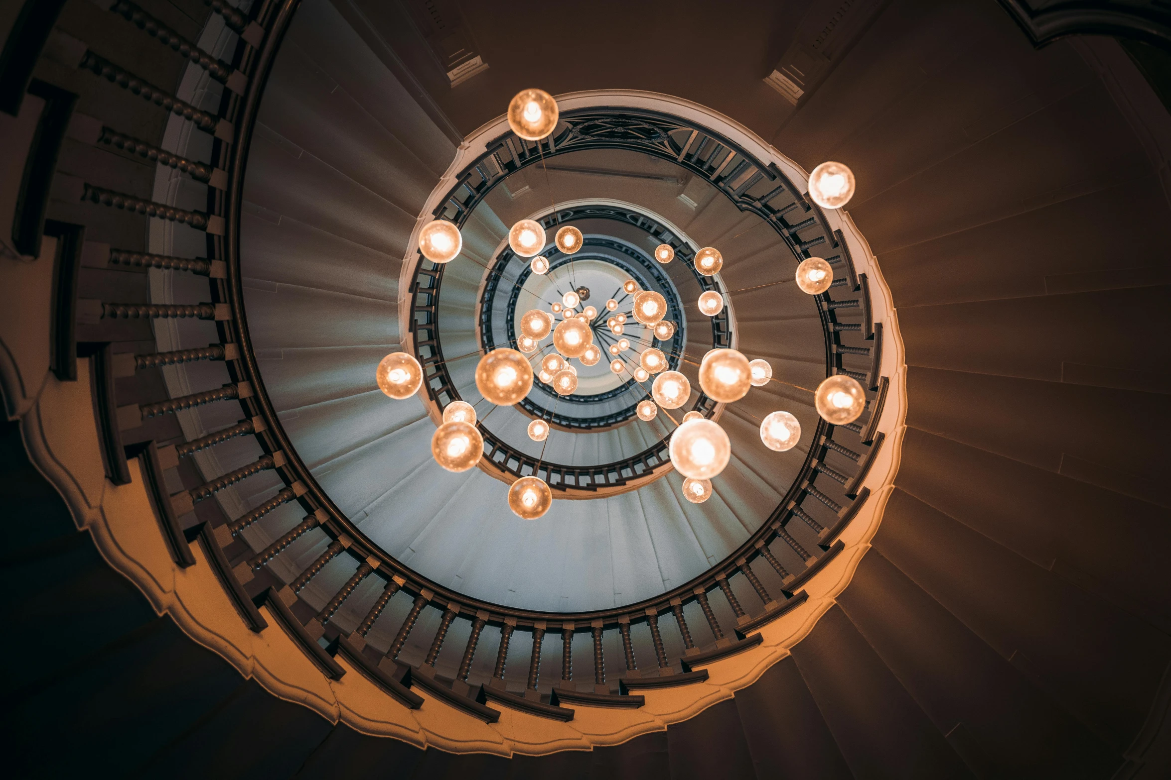 a spiral staircase with a lot of lights on it, pexels contest winner, fan favorite, balls of light for eyes, escher, symmetrical rim light