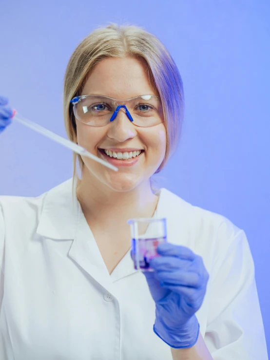 a woman in a lab coat holding a tube of liquid, trending on reddit, silicone skin, glassware, academic painting, blue