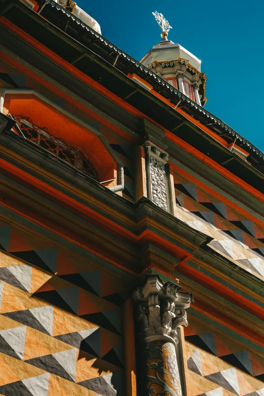 a tall building with a clock on top of it, inspired by Luis Paret y Alcazar, pexels contest winner, renaissance, orange details, detail face, japanese temple, view from the side