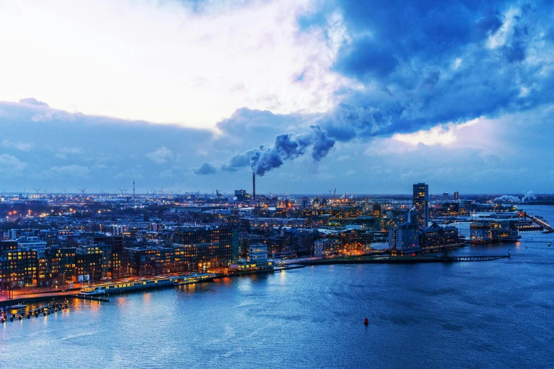 a large body of water next to a city, by Jan Tengnagel, pexels contest winner, analytical art, industrial party, cold atmosphere, profile picture 1024px, early evening