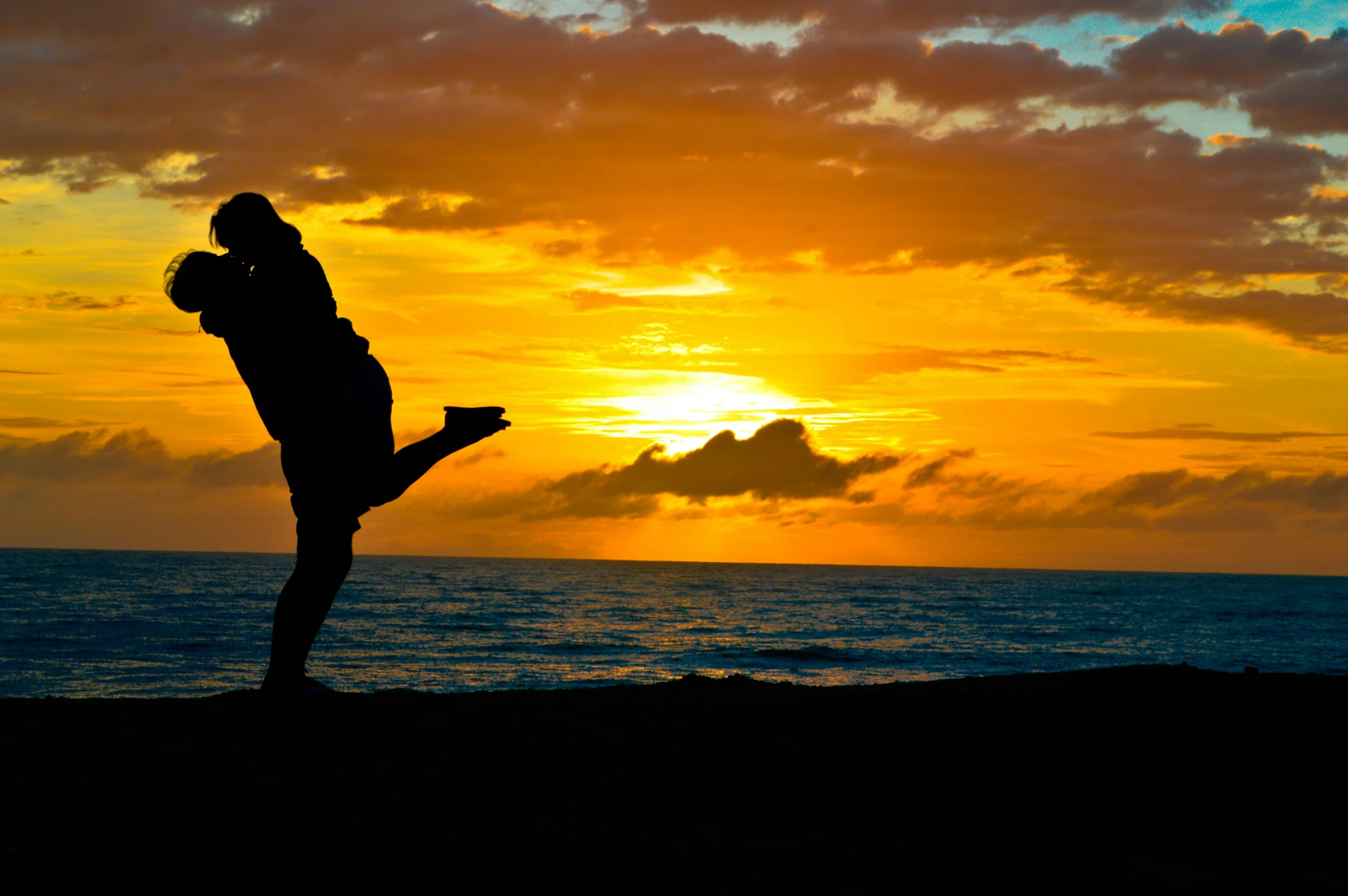 a man standing on top of a beach next to the ocean, a picture, pexels contest winner, romanticism, couple dancing, avatar image, doing a kick, silhoutte