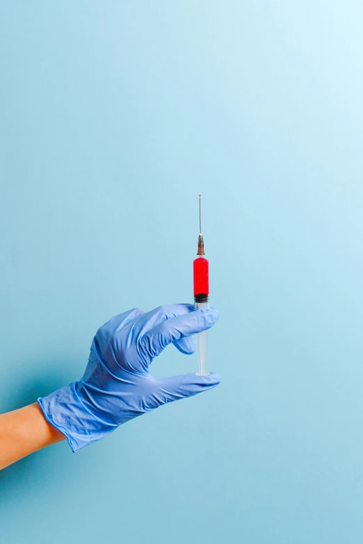 a person holding a syet in their hand, shutterstock, plasticien, syringe, blue or red, sterile minimalistic room, glamor shot