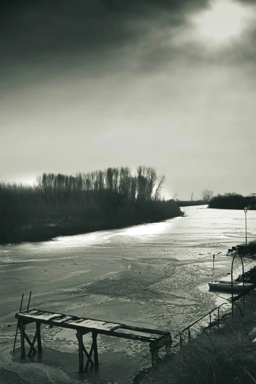 a black and white photo of a body of water, on the frozen danube, helmond, dramatic lighting - n 9, overview