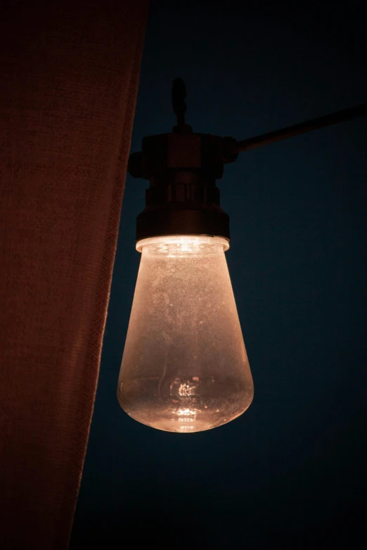 a light bulb hanging off the side of a building, hibernation capsule close-up, al fresco, faded glow, grey