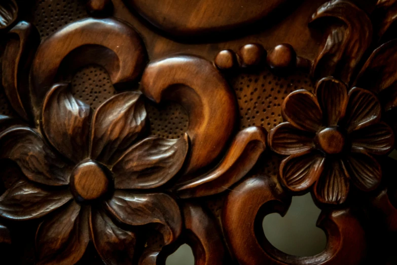 a clock sitting on top of a wooden table, by Leo Michelson, pexels contest winner, arts and crafts movement, detail face, wood carved chair, swirling flowers, hoog detail