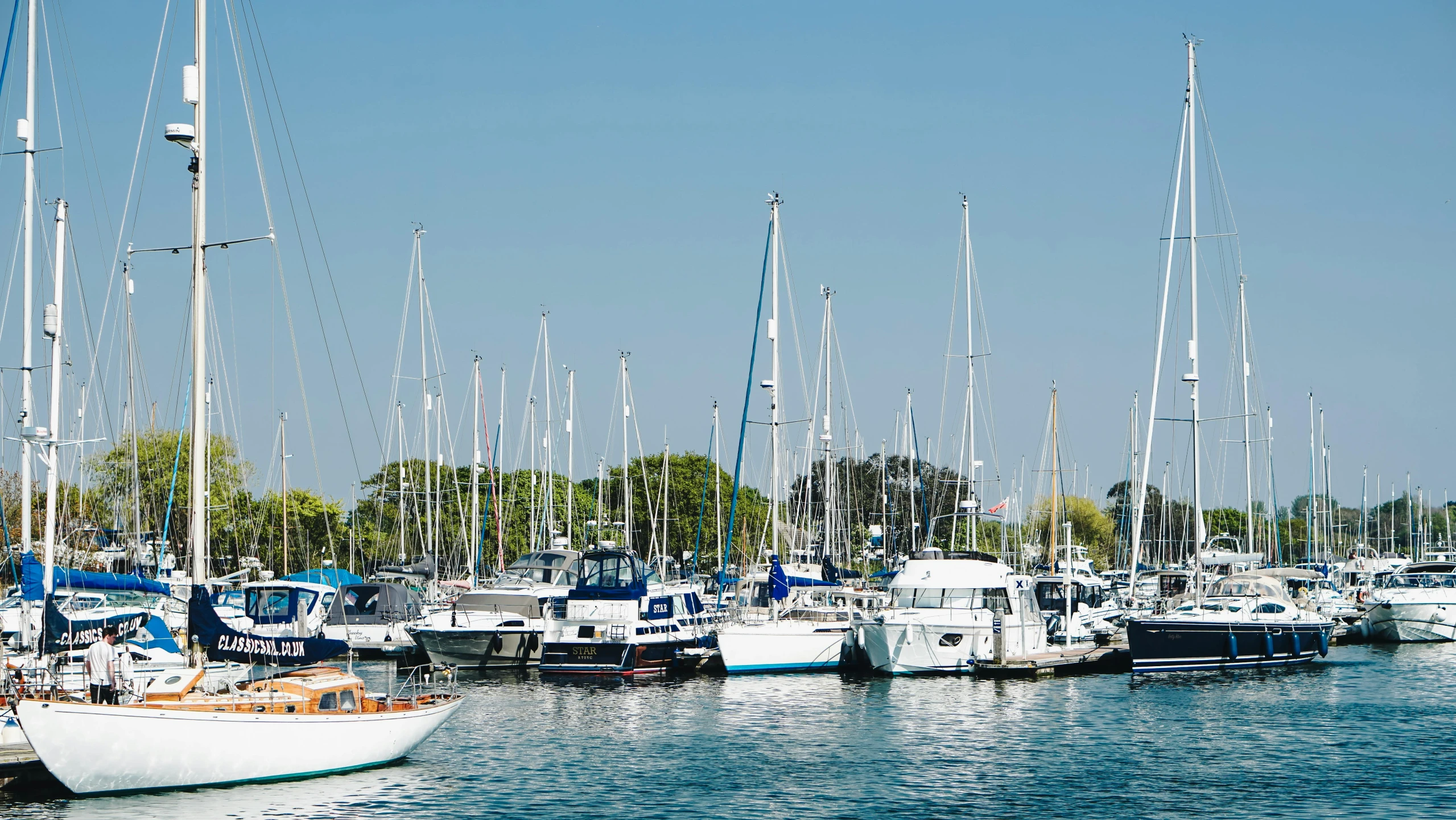 a number of boats in a body of water, a photo, by Gawen Hamilton, pexels contest winner, on a bright day, caulfield, exterior shot, johanna martine