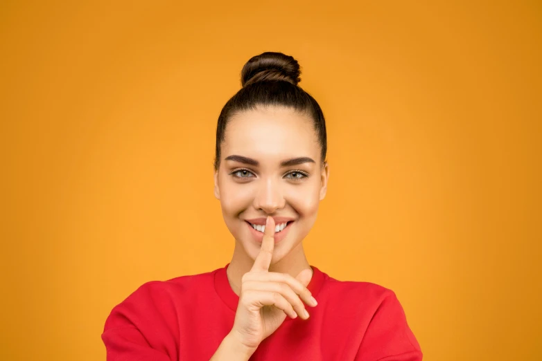 a woman in a red shirt holding her finger to her lips, a picture, by Andries Stock, shutterstock contest winner, antipodeans, orange skin, 15081959 21121991 01012000 4k, square nose, secret <
