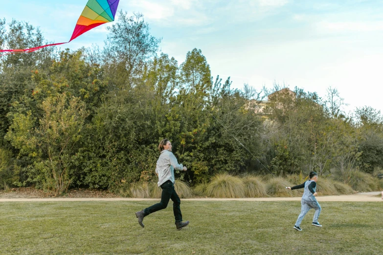 a couple of people that are flying a kite, sydney park, multicoloured, fan favorite, multiple wide angles
