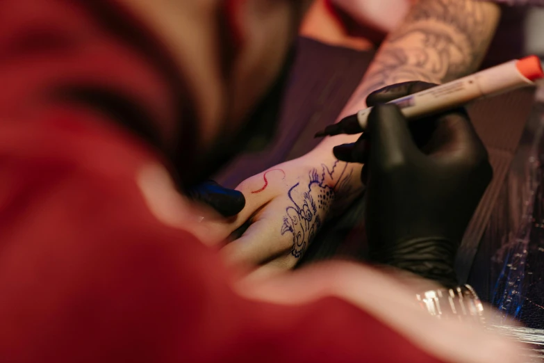 a man getting a tattoo on his arm, trending on pexels, process art, ilustration, red ink sharp focus, caligraphy, thumbnail
