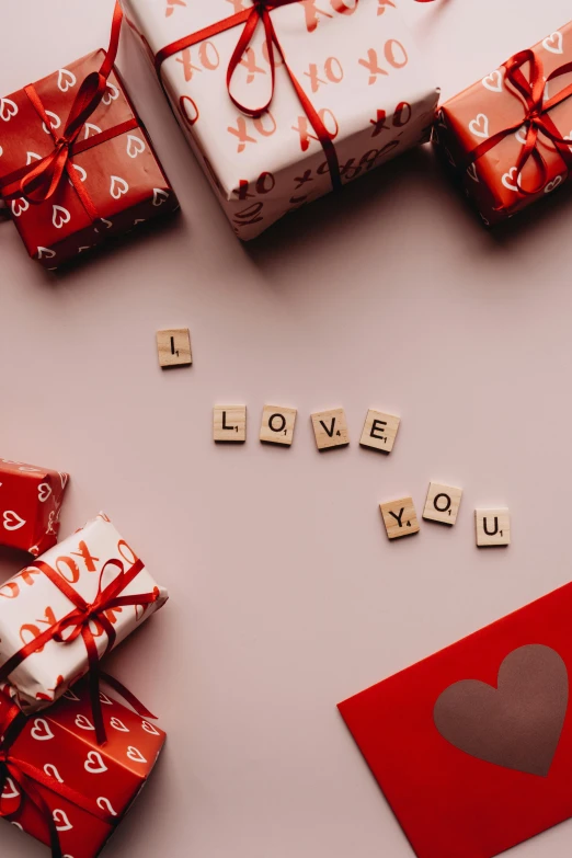 a bunch of presents sitting on top of a table, by Valentine Hugo, trending on pexels, graffiti, i love you, label, full frame image, lv