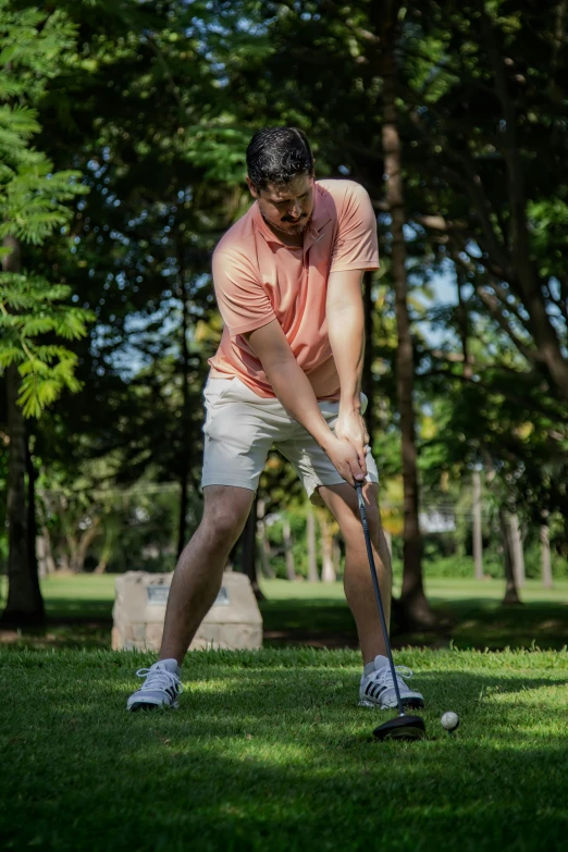 a man taking a swing at a golf ball, a portrait, by david rubín, unsplash, happening, knees weak, avatar image, ross tan, bent - over posture