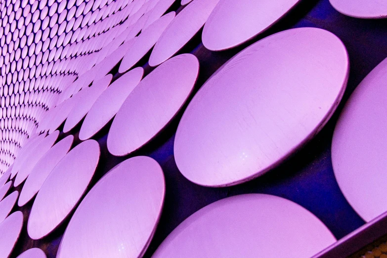 a wall that has a lot of circles on it, inspired by Yahoo Kusama, unsplash, soft purple glow, metal panels, the british museum, round-cropped