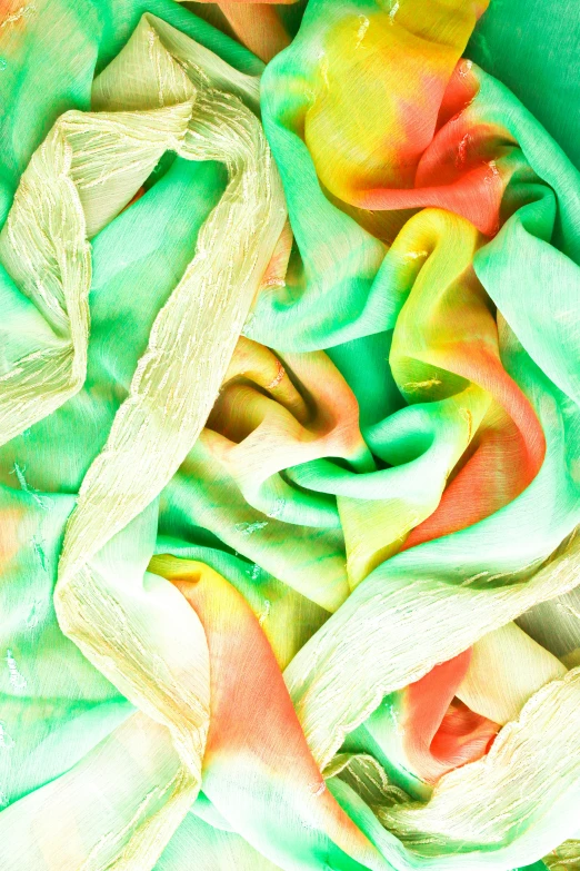 a bowl filled with lots of green and orange dye, an album cover, inspired by Michelangelo Buonarotti, wearing a long flowy fabric, pastel gradients, detail shot, ruffled fabric