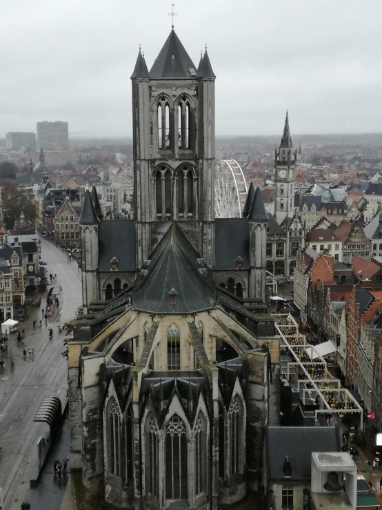 a view of a city from the top of a building, inspired by Barthélemy d'Eyck, gothic church background, grey, helmond, proud looking
