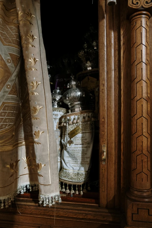 a clock sitting on top of a wooden cabinet, spirits covered in drapery, jerusalem, palace of the chalice, teaser