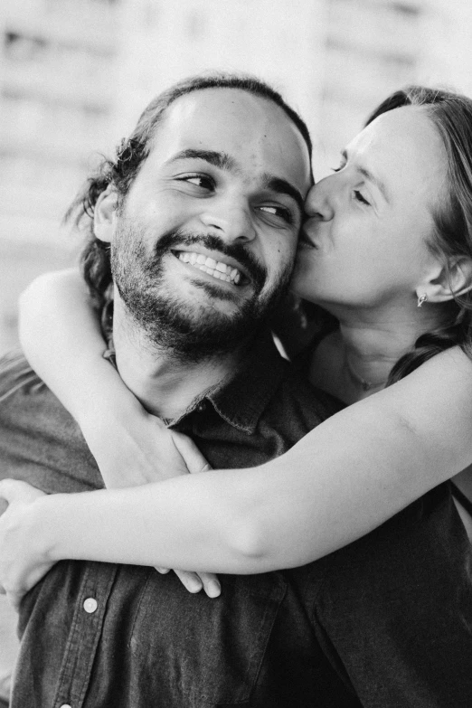 a black and white photo of a man and woman, a black and white photo, pexels contest winner, hugs, hannah yata charlie immer, dimples, raphael lecoste