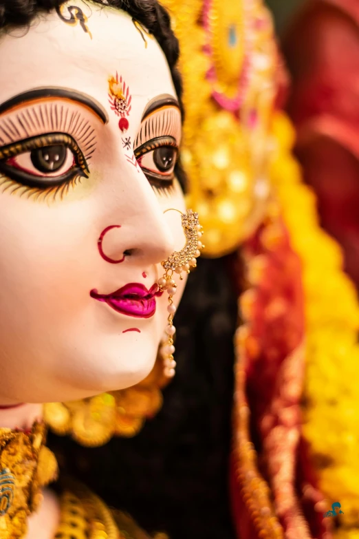 a close up of a statue of a woman, a statue, trending on unsplash, bengal school of art, attractive male deity, square, beautiful eyes medium shot, festival of rich colors