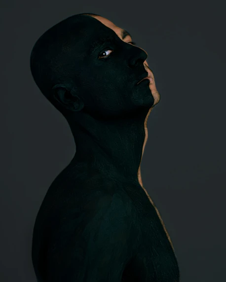 a man with black paint on his body, an album cover, inspired by Odd Nerdrum, unsplash contest winner, non binary model, face profile, iridescent skin, bald lines