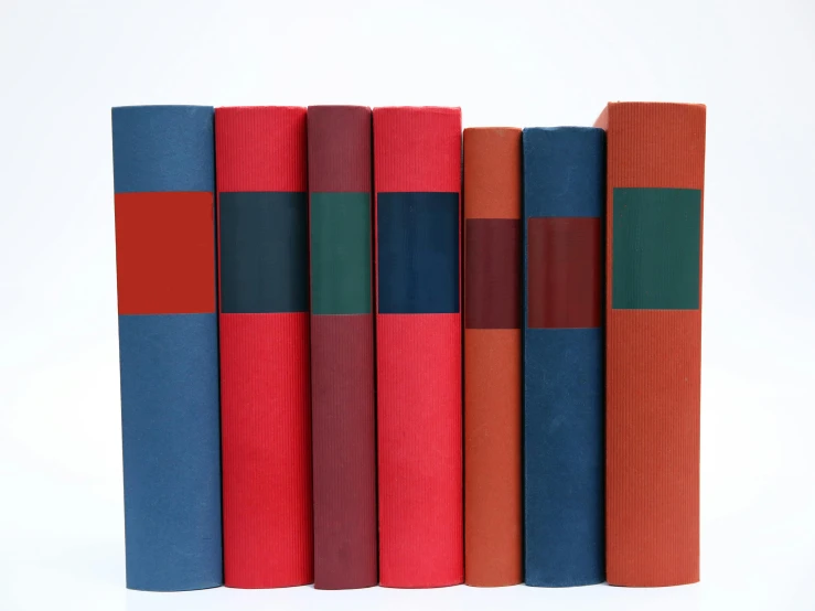 a row of books sitting on top of each other, an album cover, by Doug Ohlson, academic art, red and blue color theme, ƒ5.6, linen, thumbnail