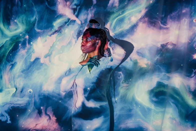 a woman that is standing in front of a painting, by Julia Pishtar, pexels contest winner, afrofuturism, iridescent smoke behind, floating in space, doing a majestic pose, playboi carti portrait