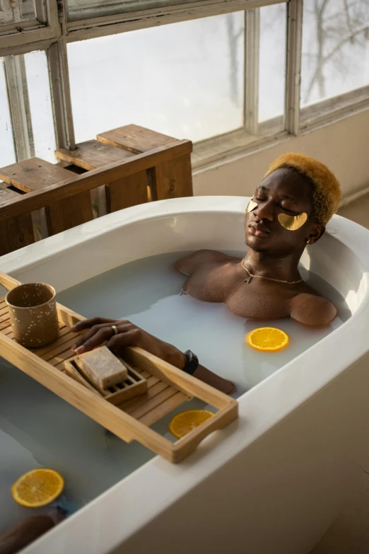 a woman sitting in a bathtub with a tray of orange slices, trending on pexels, renaissance, afrofuturism style, blonde man, square, swimming in a pool of coffee