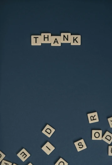 the word thank spelled with scrabbles on a blue background, an album cover, by Andrew Domachowski, on grey background, promo image, dan eder, holiday season