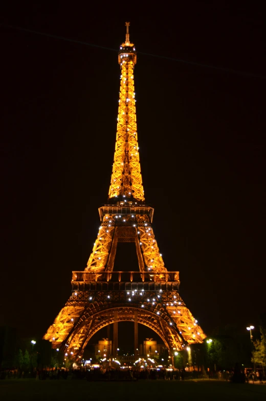 the eiffel tower is lit up at night, very elegant & complex, july 2 0 1 1, best photo