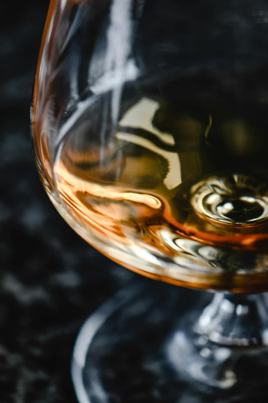 a close up of a glass of wine on a table, inspired by William Grant Stevenson, unsplash, renaissance, caramel, clear curvy details, rum, malt