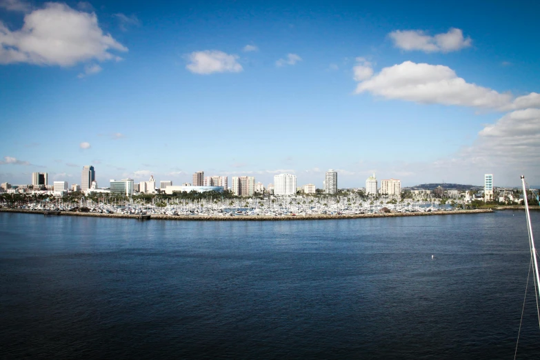 a large body of water with a city in the background, oceanside, city docks, city views, gigapixel photo