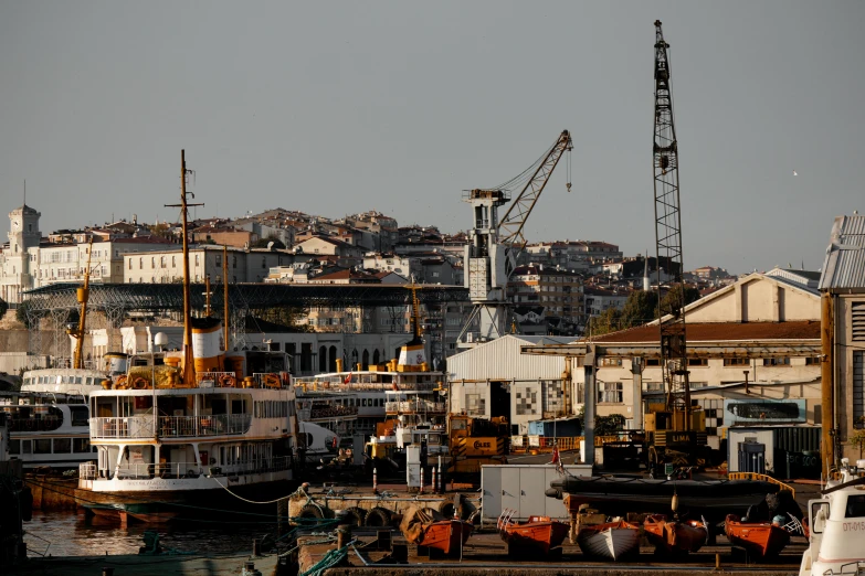 a harbor filled with lots of boats sitting next to each other, a portrait, pexels contest winner, hurufiyya, industrial buildings, fallout style istanbul, thumbnail, taken with sony alpha 9