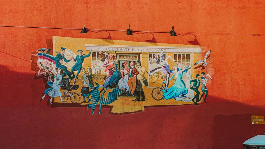 a mural on the side of a building, an art deco painting, by Meredith Dillman, pexels contest winner, dancing people, old west town, vintage color, caravaggesque style