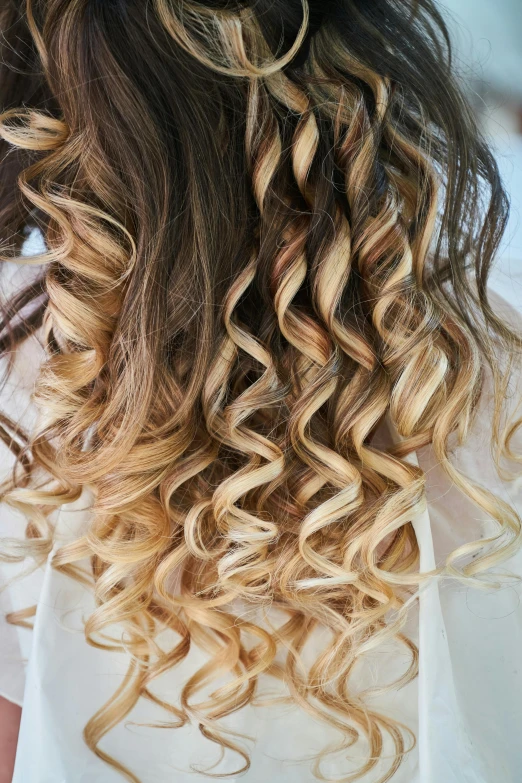 a woman with a flower in her hair, trending on pexels, long blond drill curls, ombre, pasta, using the degrade technique
