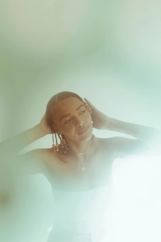 a woman standing in a bathtub with her hands on her head, a polaroid photo, inspired by Elsa Bleda, trending on pexels, renaissance, green tint, portrait of beyonce, sydney sweeney, portrait willow smith