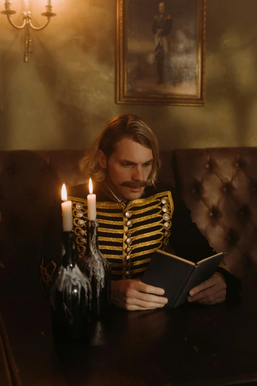 a man sitting at a table reading a book, an album cover, inspired by Karl Bryullov, trending on pexels, renaissance, huge blond moustache, candlelit, beautiful androgynous prince, gentleman's club lounge