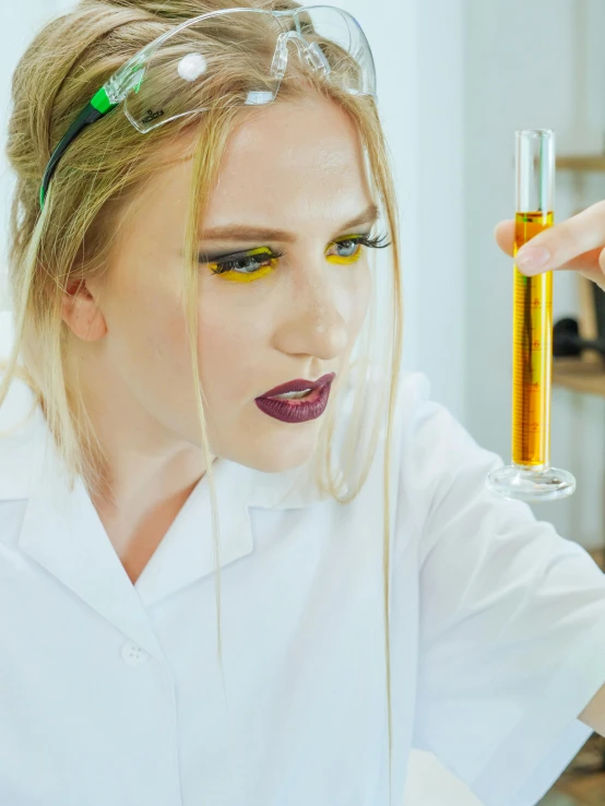 a woman in a lab coat holding a test tube, trending on pexels, analytical art, medium yellow blond hair, rave makeup, oil slick, profile picture